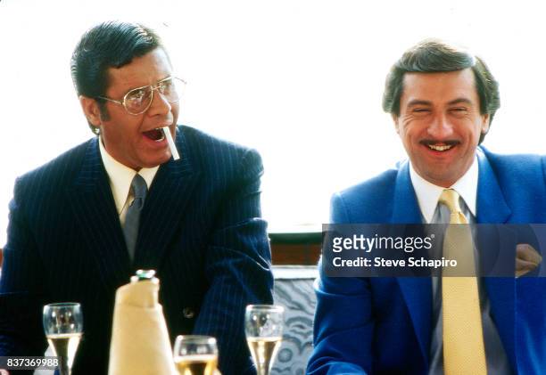 American actors Jerry Lewis and Robert De Niro share a laugh on the set of their film 'The King of Comedy' , 1982.