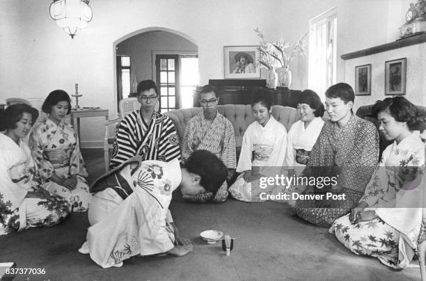 Japanese visitors, who have spent August in Denver area homes, entertain their American families Thursday night at a Japanese tea ceremony in the...