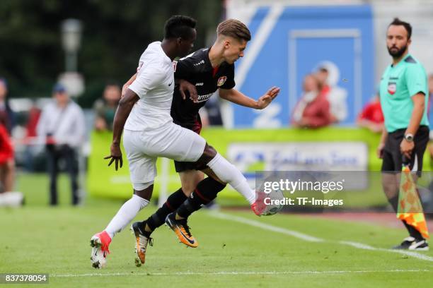 Samuel Eto and Jakub Bednarczyk of Leverkusen battle for the ball during the preseason friendly match between Bayer 04 Leverkusen and Antalyaspor on...