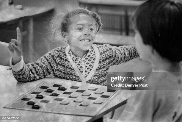 Playing With Zest When Dana Roper a first-grader at Ellsworth Elementary School, 27 S. Garfield St., plays checkers she does it with zest. She and a...