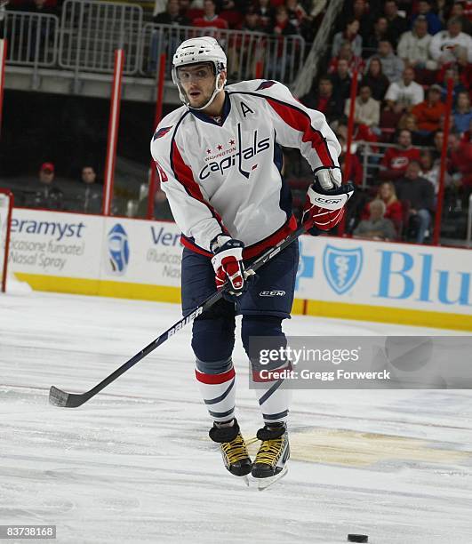 Alex Ovechkin of the Washington Capitals passes the puck during a NHL game against the Carolina Hurricanes on November 12, 2008 at RBC Center in...