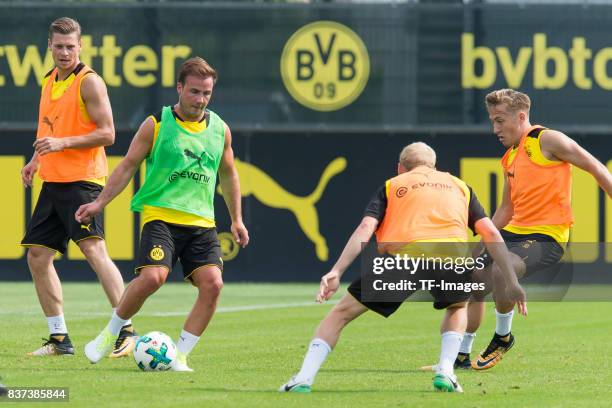 Mario Goetze of Dortmund and Felix Passlack of Dortmund battle for the ball during a training session at BVB trainings center on July 10, 2017 in...