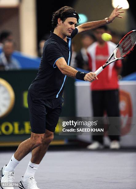 Roger Federer of Switzerland plays a shot during an exhibition match against US James Blake in Kuala Lumpur on November 18, 2008. Roger Federer...