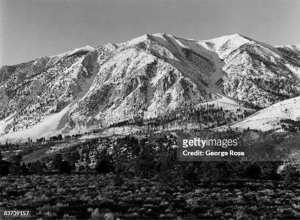 California's Eastern High Sierra mountains are covered with a heavy snowfall viewed in this 1990 Bishop, California, winter landscape photo.