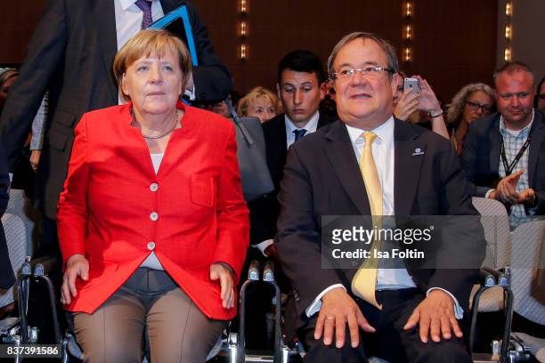 German Chancellor Angela Merkel and Armin Laschet, prime minister of the German state of North Rhine-Westphalia, attend the opening of the Gamescom...