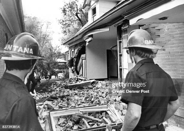 Denver Firemen Survey Remains Of An Entire Brick Wall Knocked Out By Gas Explosion At House At 476 S.Logan St. The house was undergoing renovation...