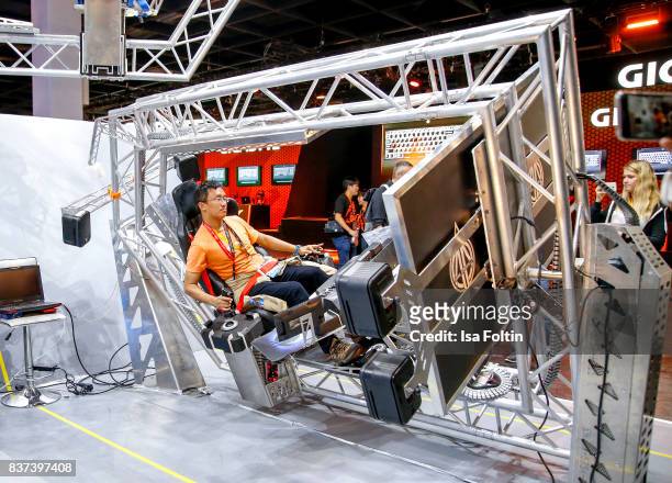 Gaming enthusiast play a video game at the Gamescom 2017 gaming trade fair on August 22, 2017 in Cologne, Germany. Gamescom is the world's largest...