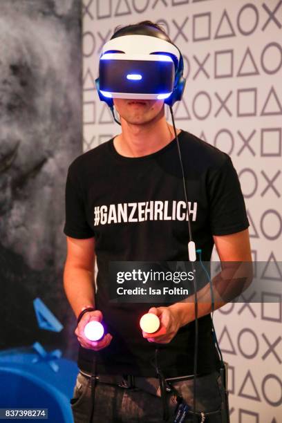 Gaming enthusiasts try out a virtual reality game at the Gamescom 2017 gaming trade fair on August 22, 2017 in Cologne, Germany. Gamescom is the...