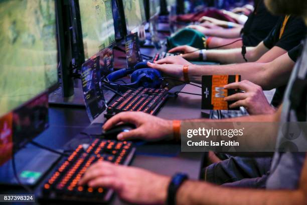 Gaming enthusiasts try out a virtual reality game at the Gamescom 2017 gaming trade fair on August 22, 2017 in Cologne, Germany. Gamescom is the...