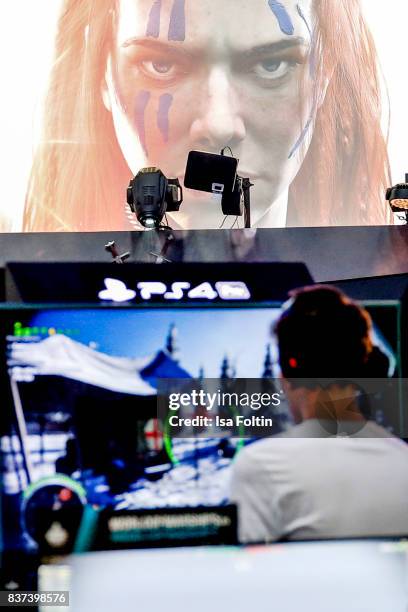 Gaming enthusiast try out a virtual reality game at the Gamescom 2017 gaming trade fair on August 22, 2017 in Cologne, Germany. Gamescom is the...