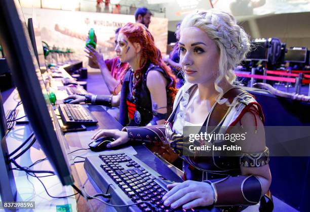 Cosplay enthusiasts try out a virtual reality game at the Gamescom 2017 gaming trade fair on August 22, 2017 in Cologne, Germany. Gamescom is the...