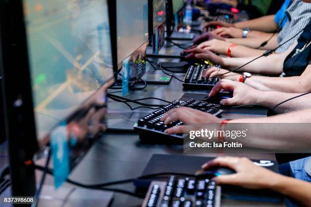 Gaming enthusiasts try out a virtual reality game at the Gamescom 2017 gaming trade fair on August 22, 2017 in Cologne, Germany. Gamescom is the...