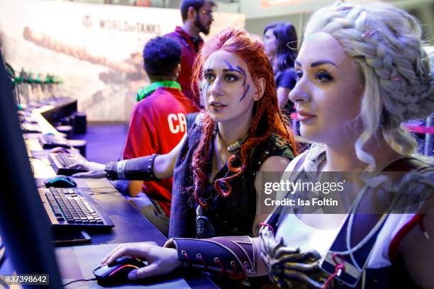 Cosplay enthusiasts try out a virtual reality game at the Gamescom 2017 gaming trade fair on August 22, 2017 in Cologne, Germany. Gamescom is the...