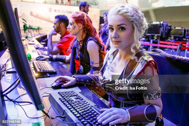 Cosplay enthusiasts try out a virtual reality game at the Gamescom 2017 gaming trade fair on August 22, 2017 in Cologne, Germany. Gamescom is the...