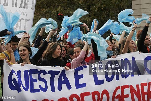 Students march during a demonstration holding a banner reading "this is the wave" on November 14, 2008 in Rome, Italy. "Onda", that traslates in...