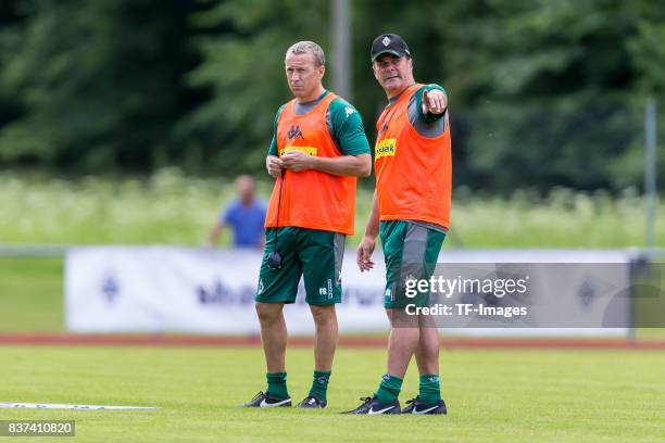 Co-coach Frank Geideck of Borussia Moenchengladbach Head coach Dieter Hecking of Borussia Moenchengladbach gestures during a training session at the...