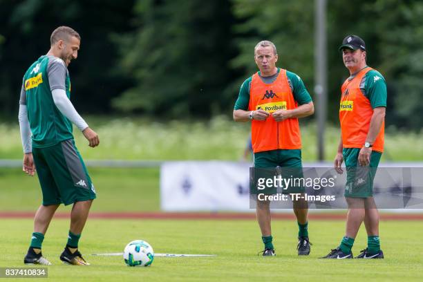 Co-coach Frank Geideck of Borussia Moenchengladbach Head coach Dieter Hecking of Borussia Moenchengladbach looks on during a training session at the...