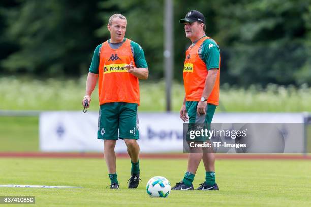 Co-coach Frank Geideck of Borussia Moenchengladbach Head coach Dieter Hecking of Borussia Moenchengladbach looks on during a training session at the...