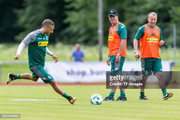 Co-coach Frank Geideck of Borussia Moenchengladbach Head coach Dieter Hecking of Borussia Moenchengladbach looks on during a training session at the...