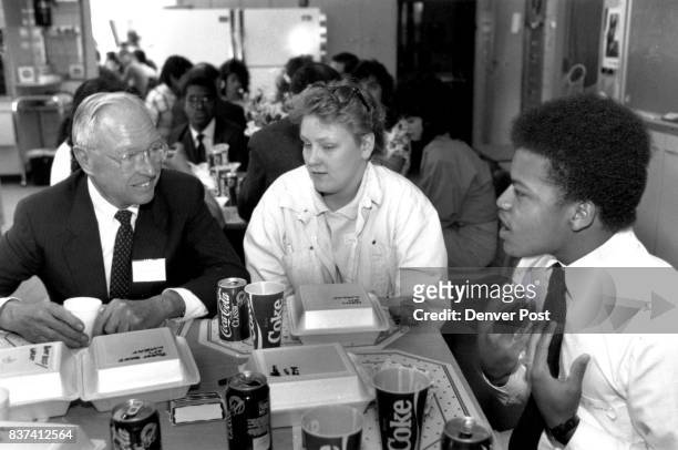 Supreme Court Justice, William H. Erickson has lunch with Abraham Lincoln High school student, Shannon Eighmy and Stephen Morris. Credit: The Denver...