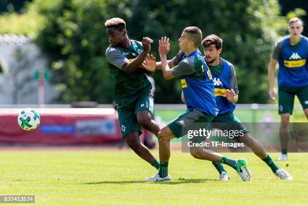 Tobias Strobl of Borussia Moenchengladbach Laszlo Benes of Borussia Moenchengladbach and Ba-Muaka Simakala of Borussia Moenchengladbach battle for...