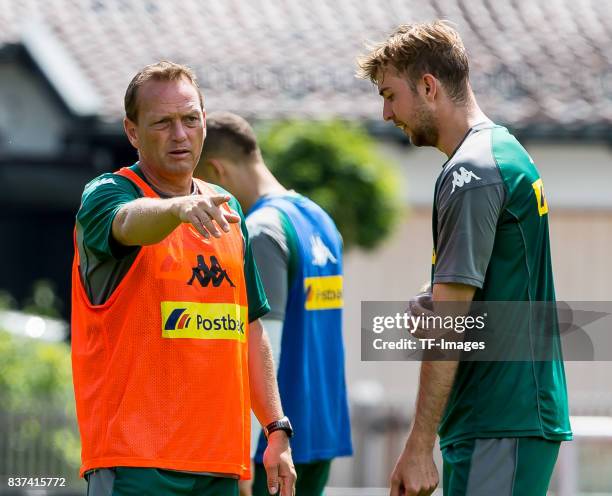 Co-coach Dirk Bremser of Borussia Moenchengladbach speak with Christoph Kramer of Borussia Moenchengladbach during a training session at the Training...