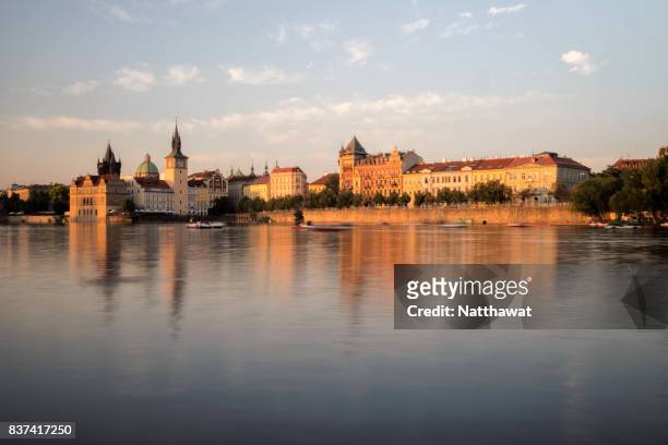 reflection of bedrich smetana museum and staromestska vodarna along vltava river in prague - smetana museum stock pictures, royalty-free photos & images
