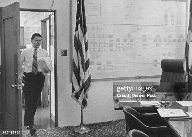Dill brings papers from old office into the chief's desk. He spent much of Thursday morning transfering papers. His long work days are just starting....