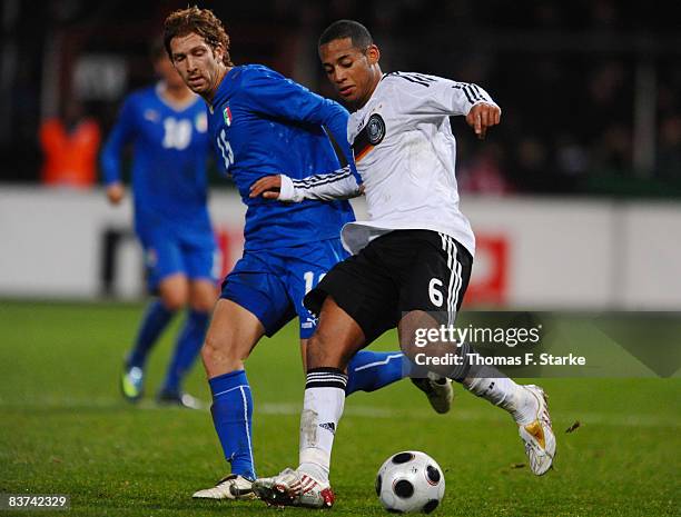 Davide Bottone of Italy and Dennis Aogo of Germany tackle for the ball during the men's U21 international friendly match between Germany and Italy at...