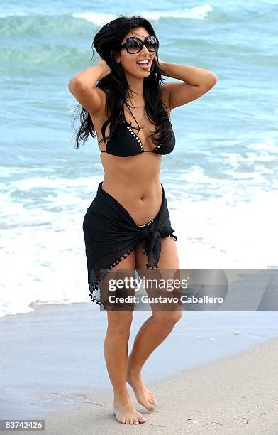 Actress Kim Kardashian poses for photographs on November 14, 2008 in Miami Beach, Florida.