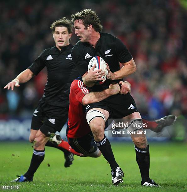 Jason Eaton of the All Blacks is tackled during the Munster V New Zealand All Blacks rugby match at Thomond Park on November 18, 2008 in Limerick,...