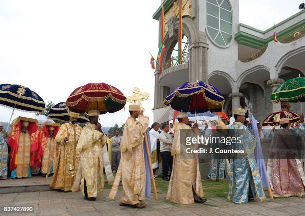 Deacons walk ahead of Priests carrying the Tabot, a representation of the Ark of the Covenant as they lead followers of the Ethiopian Orthodox...