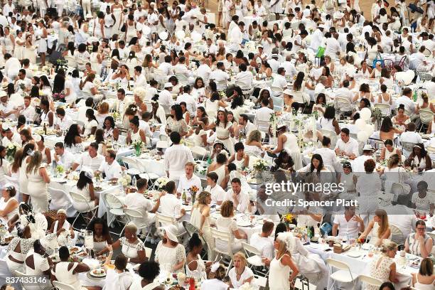 Thousands of diners participate in the annual "Diner en Blanc" at Lincoln Center on August 22, 2017 in New York City. Diner en Blanc began in France...