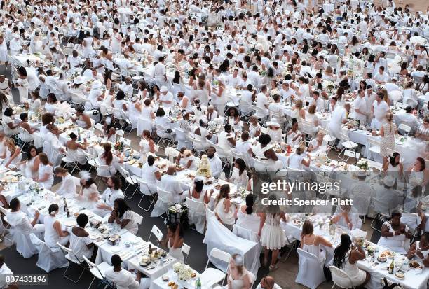 Thousands of diners participate in the annual "Diner en Blanc" at Lincoln Center on August 22, 2017 in New York City. Diner en Blanc began in France...