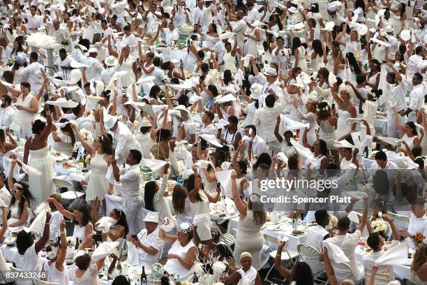 Thousands of diners participate in the annual "Diner en Blanc" at Lincoln Center on August 22, 2017 in New York City. Diner en Blanc began in France...