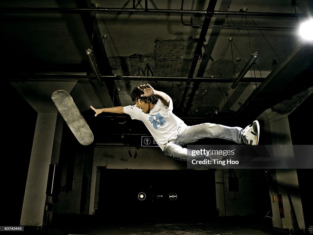 Male skateboarder in midair