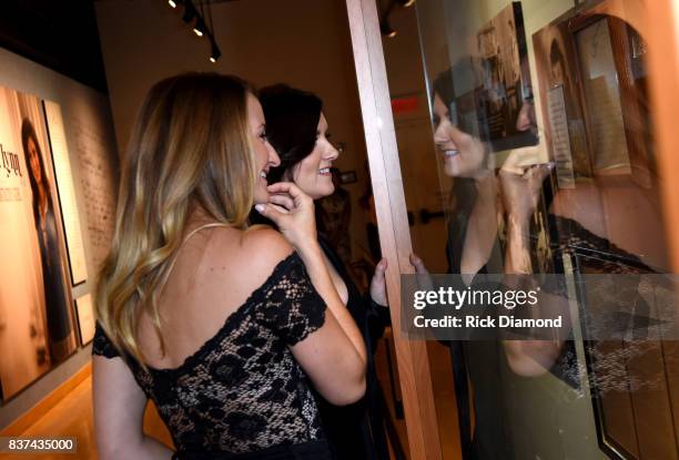 Margo Price and Brandy Clark view the Loretta Lynn: Blue Kentucky Girl exhibit at the Country Music Hall of Fame and Museum on August 22, 2017 in...