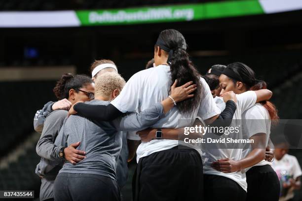 Assistant coach Shelley Patterson, Maya Moore of the Minnesota Lynx and teammates huddle before the game against the Phoenix Mercury on August 22,...