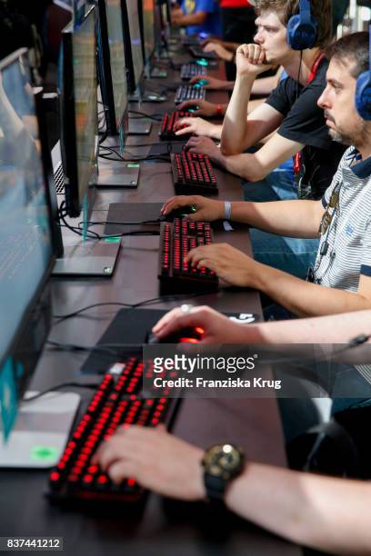 Visitors try out a virtual reality game at the Gamescom 2017 gaming trade fair during the media day on August 22, 2017 in Cologne, Germany. Gamescom...