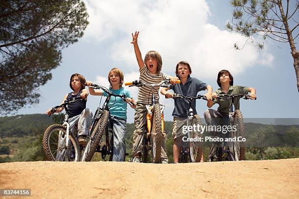 boys on bicycles - kids on bikes stockfoto's en -beelden
