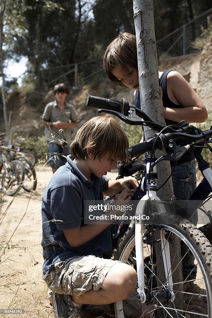 Boy investigates bicycle