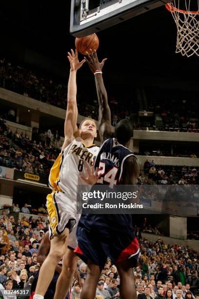 Rasho Nesterovic of the Indiana Pacers shoots over Marvin Williams of the Atlanta Hawks at Conseco Fieldhouse on November 18, 2008 in Indianapolis,...