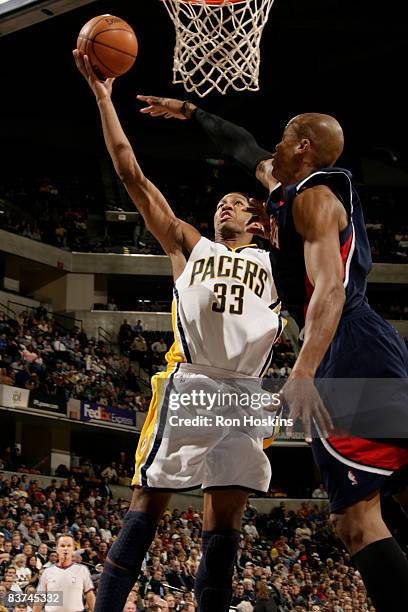 Danny Granger of the Indiana Pacers shoots over Maurice Evans of the Atlanta Hawks at Conseco Fieldhouse on November 18, 2008 in Indianapolis,...