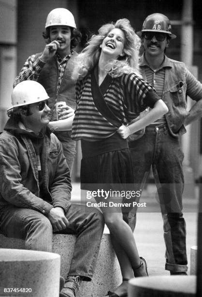 Blue and black striped cotton top is by Nancy Heller, and culotte skirt by Cathy Hardwick. Hardhats, from left, are Bayard Payne, Tom Bly and Everett...