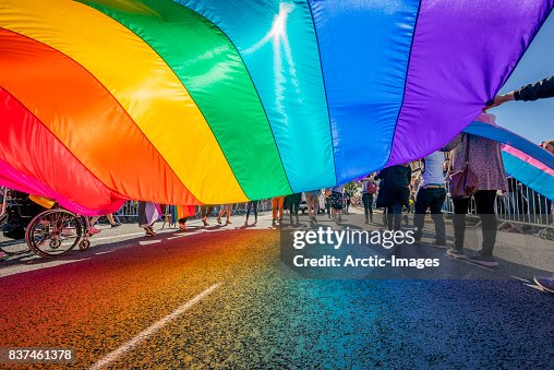 Gay Pride Parade-People marching with a large Flag, Reykjavik, Iceland Gay Pride Parade-People marching with a large Flag, Reykjavik, Iceland