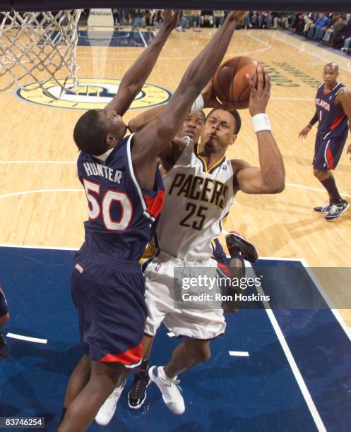 Brandon Rush of the Indiana Pacers battles Othello Hunter of the Atlanta Hawks at Conseco Fieldhouse on November 18, 2008 in Indianapolis, Indiana....