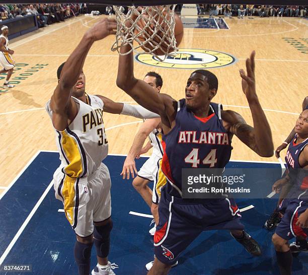 Solomon Jones of the Atlanta Hawks looks to score on Danny Granger of the Indiana Pacers at Conseco Fieldhouse on November 18, 2008 in Indianapolis,...