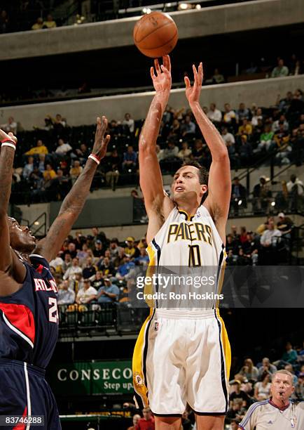 Jeff Foster of the Indiana Pacers shoots over a Atlanta Hawks defender at Conseco Fieldhouse on November 18, 2008 in Indianapolis, Indiana. NOTE TO...