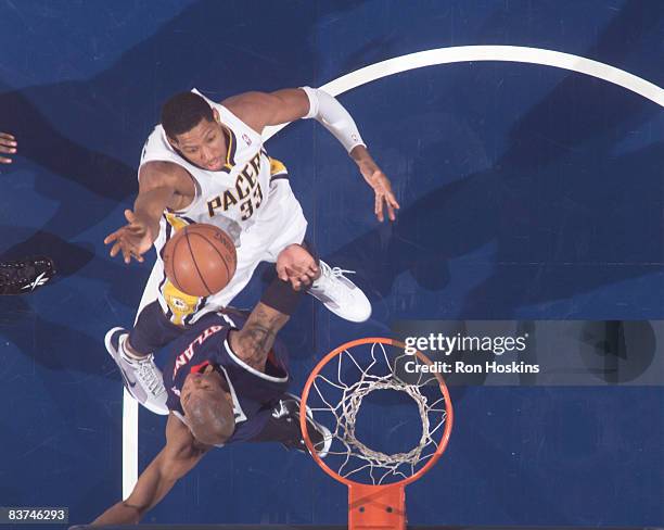 Danny Granger of the Indiana Pacers shoots over Maurice Evans of the Atlanta Hawks at Conseco Fieldhouse on November 18, 2008 in Indianapolis,...