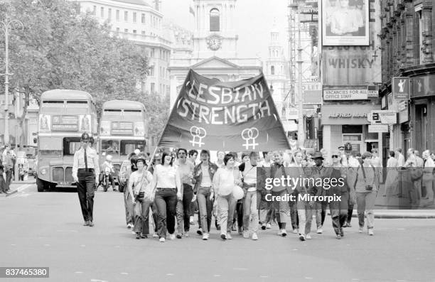Lesbian and Gay Pride March 1983 through the streets of central London escorted by police. June 1983.